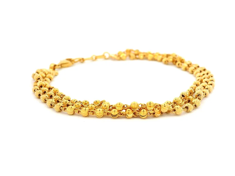 custom silver chain bracelet for women-Elegant 22ct Yellow Gold Three-Row Bracelet with Diamond-Cut Bead Design